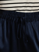 Navy silk high-waist A-line shorts with shirred drawstring waistband