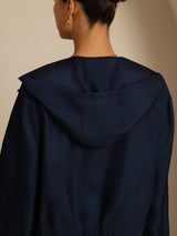 Navy blue silk hooded jacket back view with relaxed fit and short length