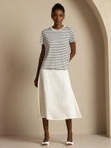 White high-waist A-line midi skirt with a smooth silk drape