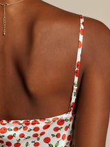 White silk blend spaghetti strap dress with red cherry print and adjustable straps