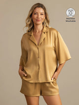 Women’s washable silk notch collar pajama set in gold, with short-sleeve shirt and side pockets