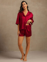 Women’s burgundy washable silk pajama set with notch collar, short sleeves, and side pockets