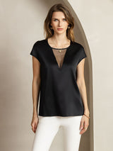 Black silk round neck cap sleeve top with sheer V insert on model