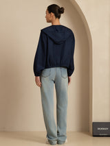 Women's navy silk hooded jacket with back view, cropped fit and long sleeves