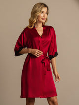 Red silk women’s robe with lace cuffs, V-neck and self-tie belt, knee-length