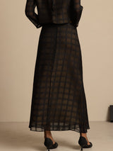 Black silk A-line skirt with textured checkered grid and back zipper
