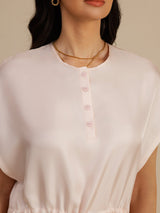 Pale blush silk Henley neck short dress with button placket and cap sleeves