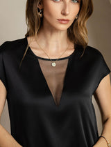 Black silk blend cap sleeve top with sheer V insert and round neckline