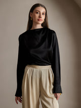 Black silk long sleeve boat neck blouse with graceful drape and tailored cuffs