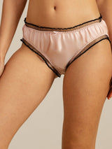 Blush silk low-rise panty with sheer finish and black ruffle trim
