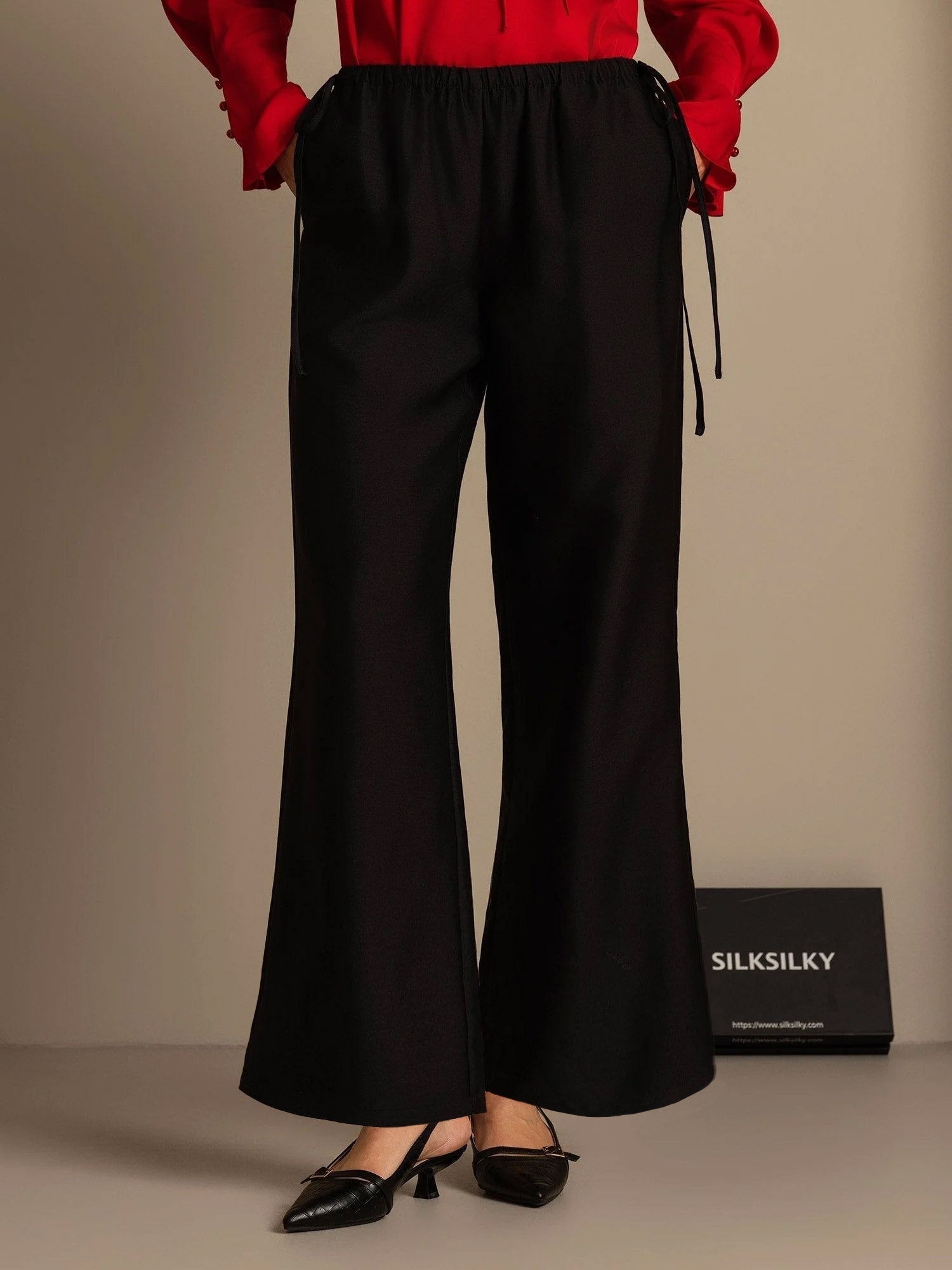 Black silk-wool blend straight-leg pants with drawstring waist and side pockets