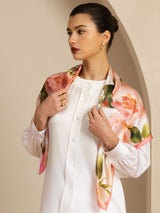 Pink floral print mulberry silk square scarf styled over a white blouse