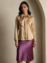 Champagne silk high neck blouse with oversized bow and long sleeves