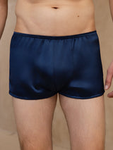 Navy blue silk boxer briefs with mid-rise elastic waistband and smooth finish