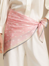 Pink 100% mulberry silk paw print square scarf worn as waist wrap