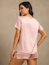 Light pink silk short-sleeve pajama set with round collar and side slit shorts, back view