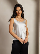 Women's sleeveless U-neck silk tank top in white satin finish, straight fit