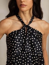 Black polka dot silk halter top with twist-front detail and keyhole neckline
