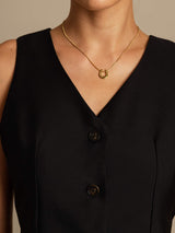 Black silk-wool blend V-neck vest with button front and gold necklace