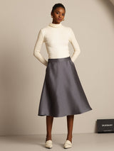 Dark gray silk-wool blend A-line midi skirt with pockets on model