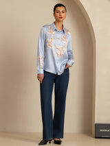 Light blue silk crane print blouse with lapel collar and button-front