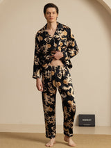 Men's black silk pajama set with gold dragon print, long sleeve notch collar top and matching pants