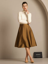 Model wearing cream ribbed top with camel silk-wool A-line midi skirt